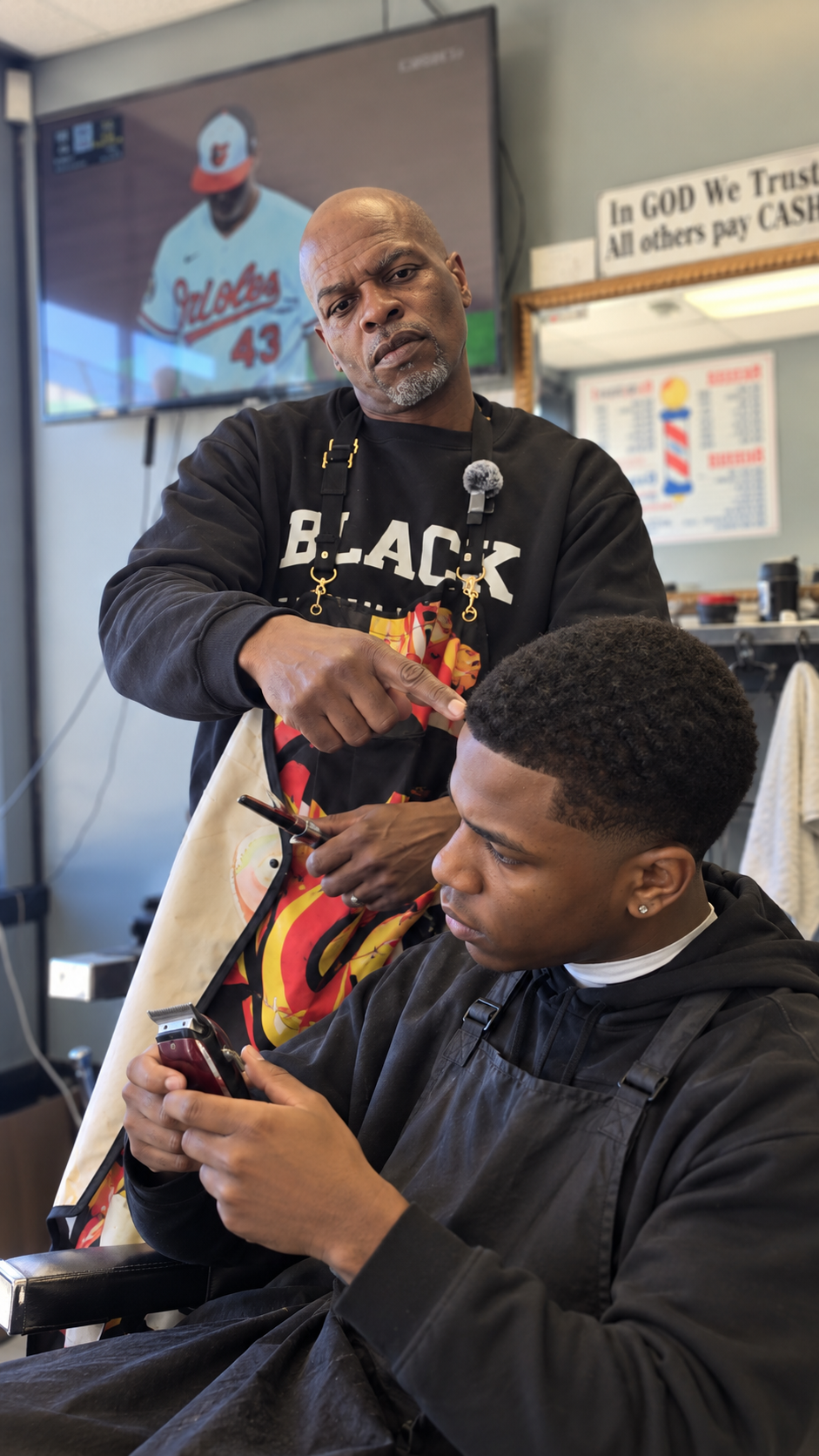 Barber working on a client's haircut